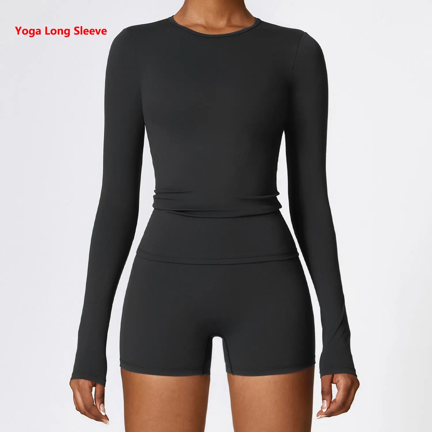Black long-sleeve top and shorts set on a white background